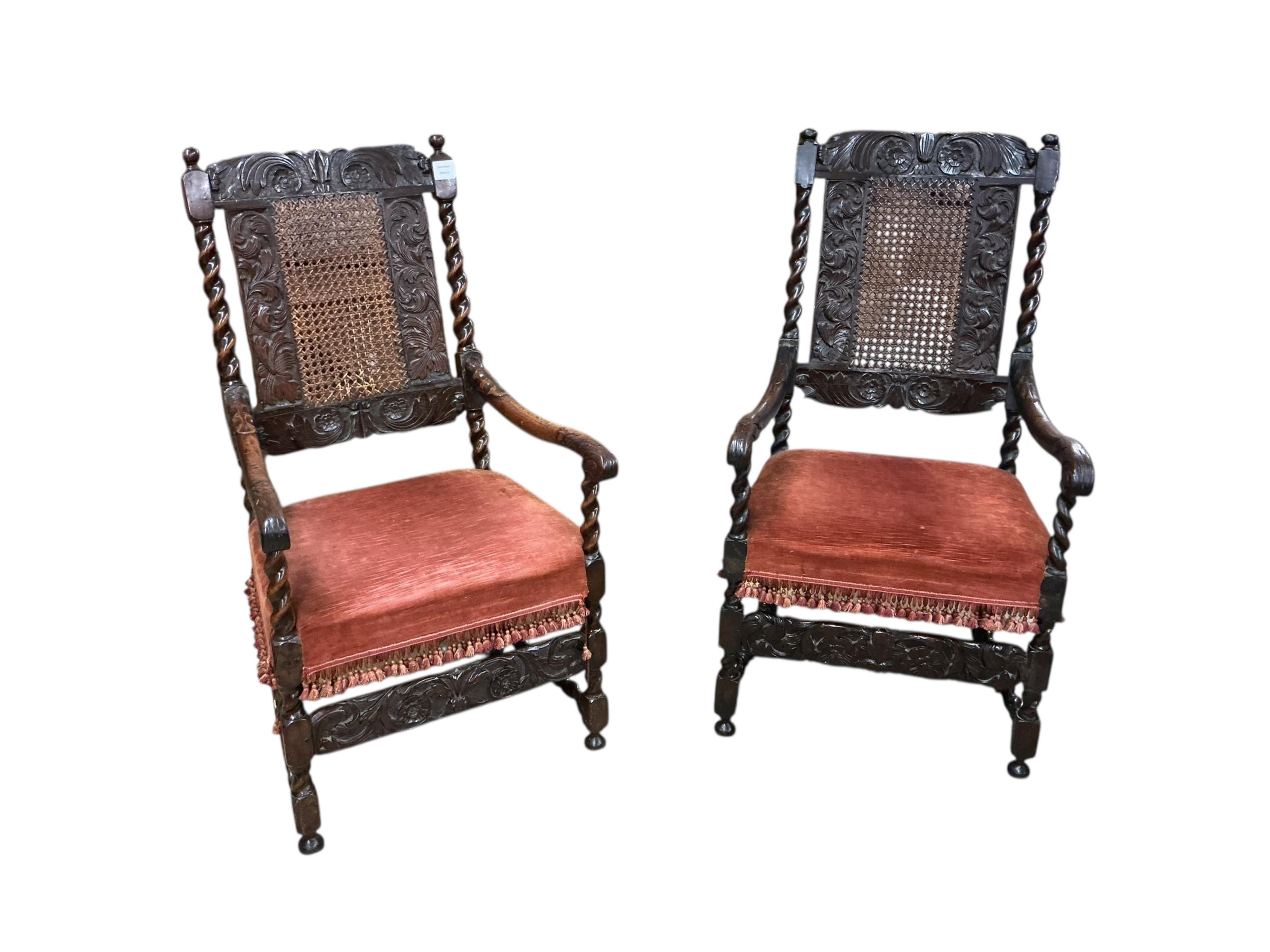 A set of four early 18th century caned walnut dining chairs, two with arms